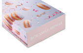 Attraktiver Karton für Krapfen oder Gebäck mit Schriftzug «bite.smile.repeat.».