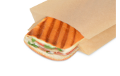 Brot erhält im Kontaktgrill durch das Papier hindurch Grillstreifen