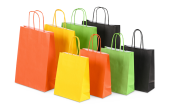 Papiertüten in verschiedenen Größen und Farben wie Gelb, Grün, Orange und Schwarz erhältlich 