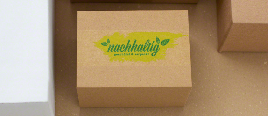 Kartonage mit bedrucktem Papierklebeband